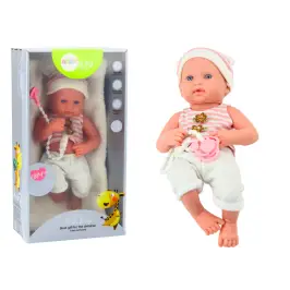 Baby doll in white and pink clothes, hat, pacifier, and blanket Baby doll in white and pink clothes, hat, pacifier, and blanket