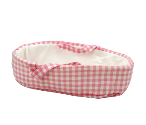 Baby doll in a bunny carrier in a pink checkered outfit Baby doll in a bunny carrier in a pink checkered outfit